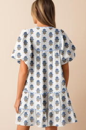 Dusty-blue floral-embroidered babydoll mini dress with puff sleeves, tiered skirt and side-pocket entry — left side view.
