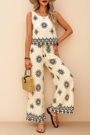 Centered front view of the beige sleeveless printed top and wide-leg pants set; scoop neckline, drawstring waist and allover black boho print.