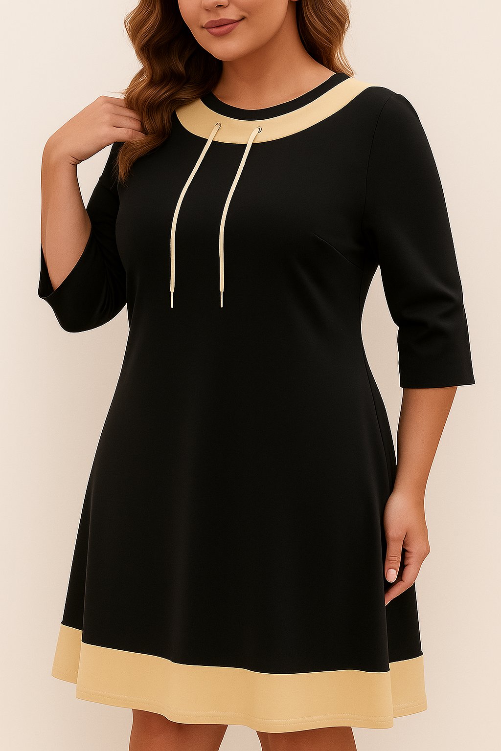 Front three-quarter view of the black A-line dress showing the beige contrast trim, drawstring neckline and three-quarter sleeves.