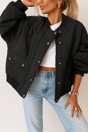 Front view of the black quilted bomber jacket with rib-knit collar and cuffs, zip front with snap placket, and snap-flap hip pockets.