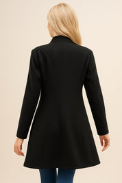 Back view of the black tailored longline coat showing the clean back panel and straight hem.