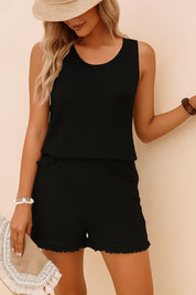 Centered front view of the black textured-knit tank and shorts set showing the wave-edge trim and relaxed drape.