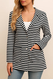 Front view of a black-and-white striped hooded snap-button long jacket with notched lapel, buttoned front and patch pockets.