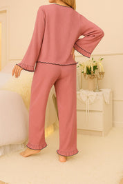 Back view of pink lounge pajama set with flared sleeves and pants