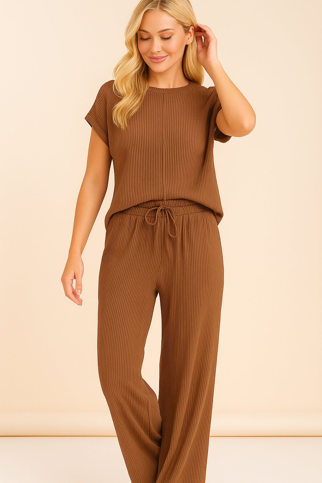 Front view of the brown ribbed lounge set showing the exposed-seam top and wide-leg pants with drawstring waist