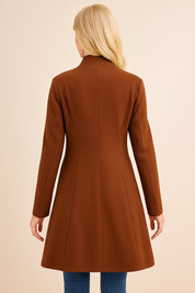 Back view of the brown tailored longline coat showing the clean panel seams, structured shoulders and straight hem.