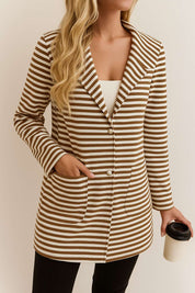 Front view of the brown-and-white striped hooded snap-button long jacket with notched lapel, buttoned front and patch pockets.
