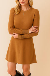 Straight-on front view of the women’s sweater dress in camel brown featuring a crew neck, long sleeves, a subtle center seam and an easy above-knee A-line shape for everyday wear.