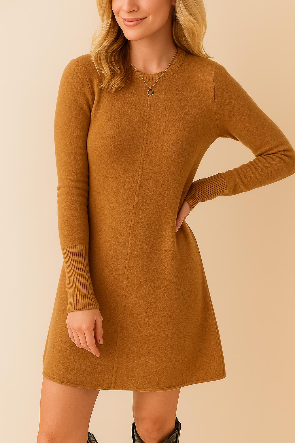 Three-quarter view of the women’s camel brown knit sweater dress showing the crew neckline, long sleeves and softly structured A-line silhouette that flatters the waist.