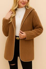 Front view of the camel brown ribbed hooded coat with open lapel, vertical rib texture and straight body