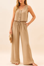 Front three-quarter view of the camel two-piece set with button-front V-neck tank and wide-leg drawstring pants; relaxed stance.
