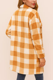 Back view of the camel-and-ivory buffalo-check coat with a shirt collar, long sleeves and a straight hem