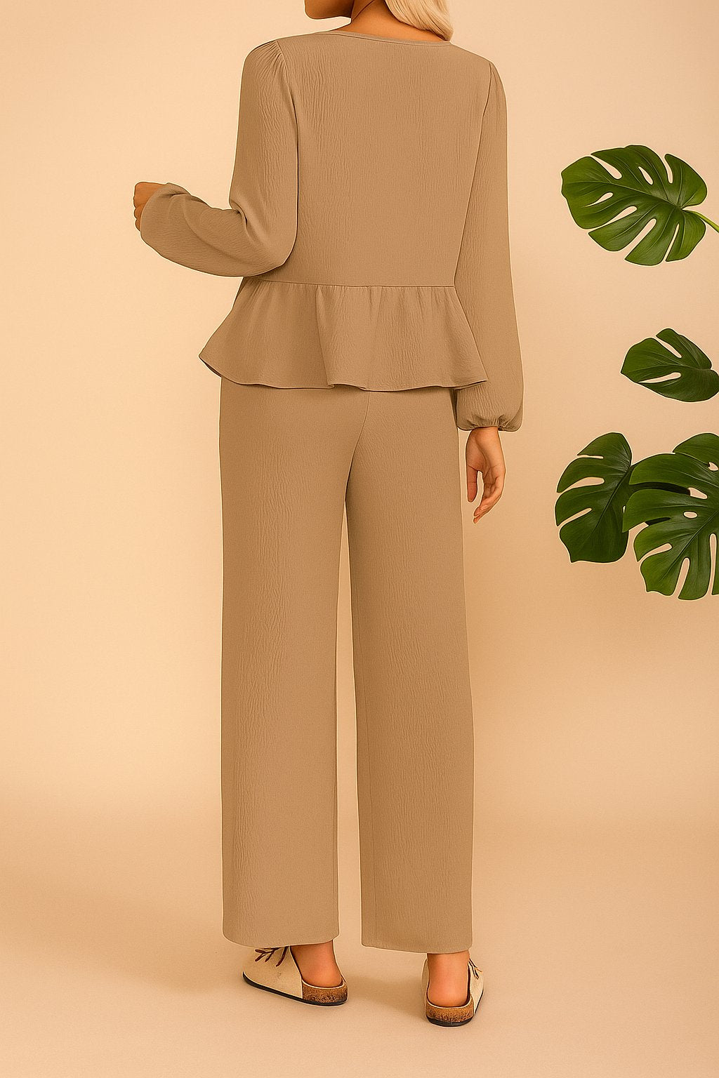 Back view of the camel tie-front peplum blouse and wide-leg pants set; straight hem.