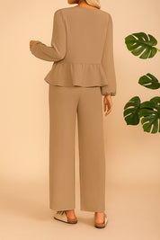 Back view of the camel tie-front peplum blouse and wide-leg pants set; straight hem.