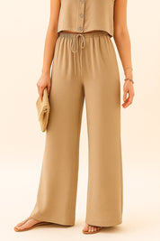 Front view of the camel wide-leg pants from the set showing the elastic drawstring waist and straight, flowing legs.
