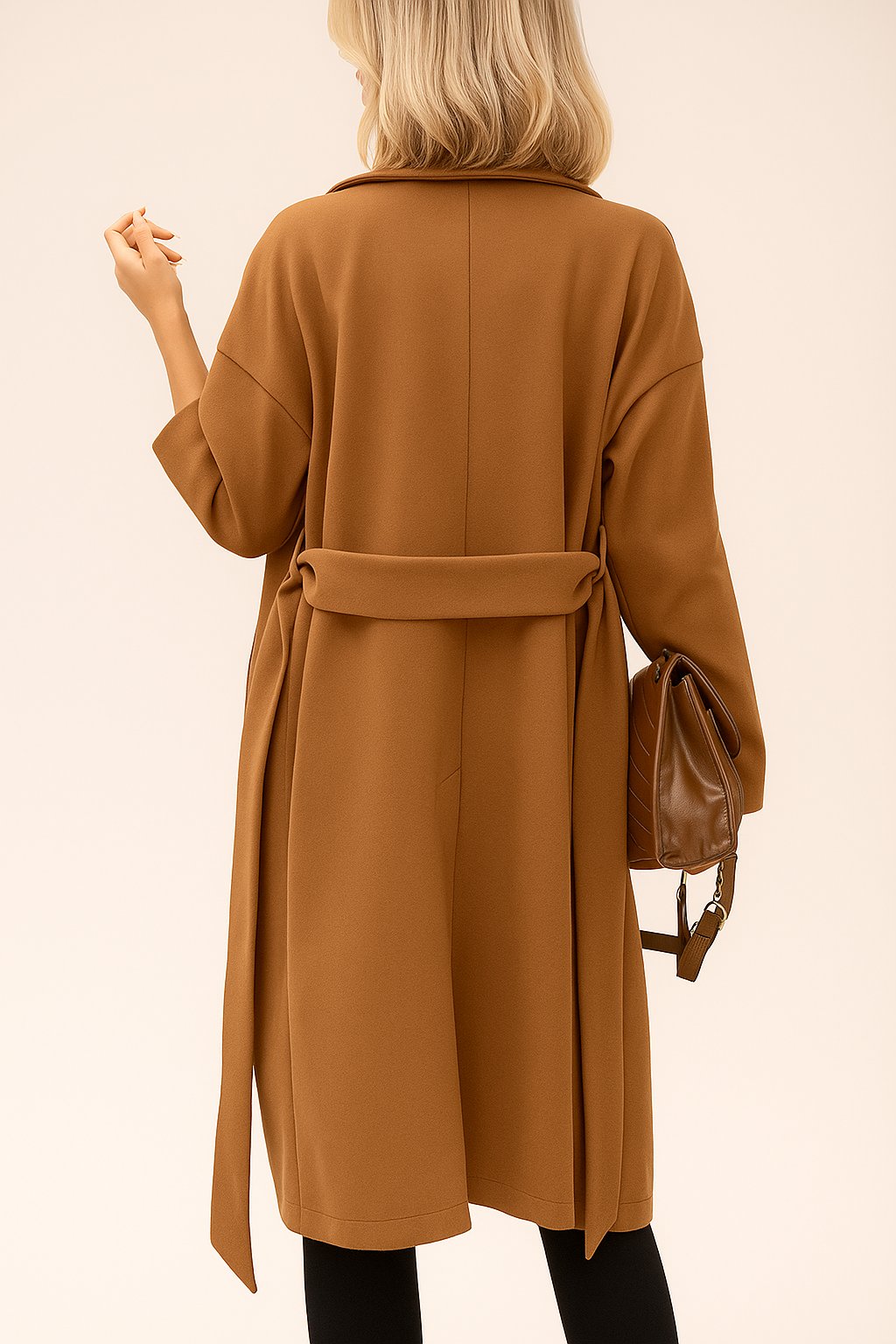 Front view of the caramel tie-waist coat with notched lapel and covered buttons; drop-shoulder sleeves and relaxed drape.
