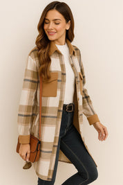 Left three-quarter view of the coffee-brown and ivory plaid longline coat showing the shirt collar, button front, flap chest pocket and slant hand pocket.