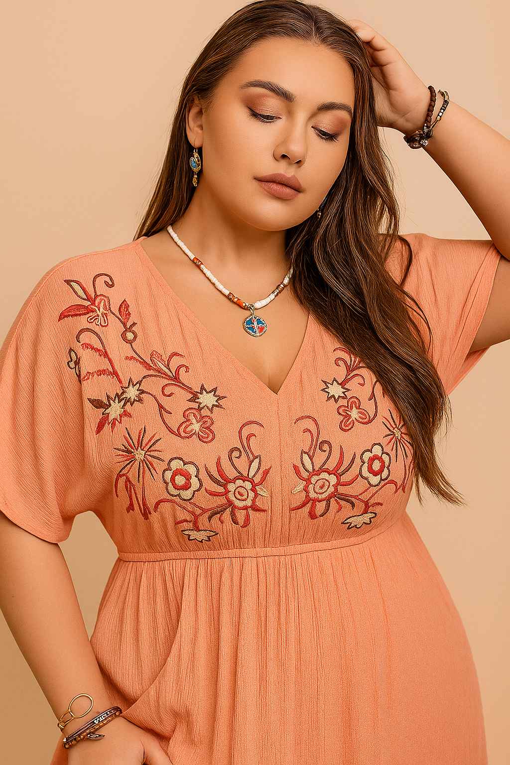 Coral frill maxi dress (plus size) showing embroidered V-neck bodice and empire-waist seam — front detail view