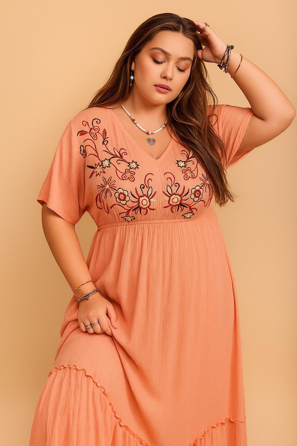 Coral embroidered V-neck frill maxi dress (plus size) with empire waist and relaxed flow — front three-quarter view.
