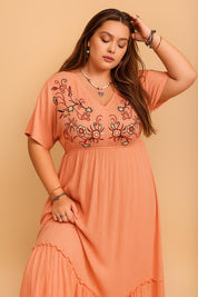 Coral embroidered V-neck frill maxi dress (plus size) with empire waist and relaxed flow — front three-quarter view.