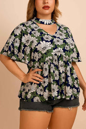 Front view of a women’s dark blue floral blouse with a V-neck cutout choker neckline, flutter short sleeves and a relaxed gathered hem (plus size)
