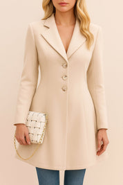 Front view of a dust-storm beige tailored longline coat featuring a notched lapel, button-front and long sleeves.