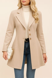 Open-lapel front view of the dust-storm beige tailored longline coat; notched lapel and button arrangement visible.