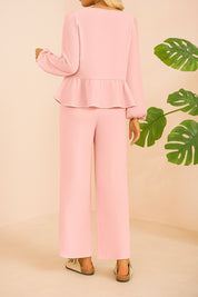 Back view of the dusty pink tie-front peplum blouse and wide-leg pants set.