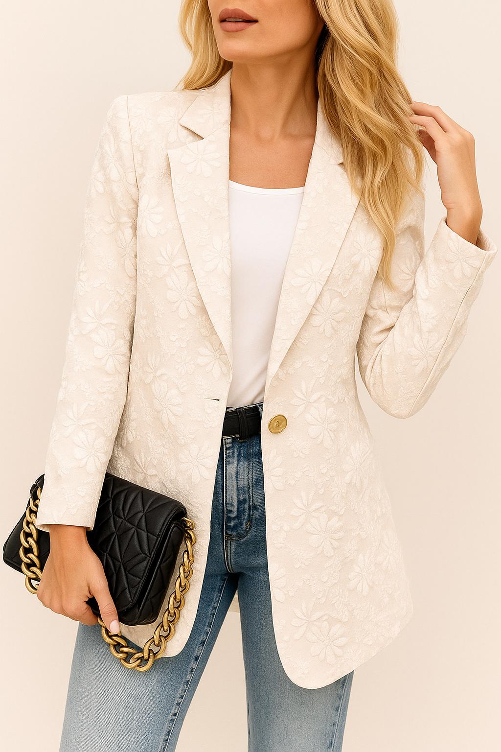 Centered front view of the eggshell floral jacquard one-button blazer showing the notched lapel and embossed flower texture.