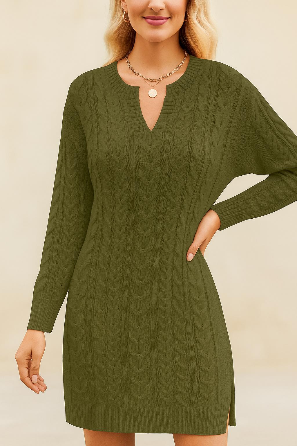 Woman wearing a green cable knit dress against a beige background