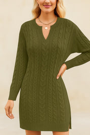 Woman wearing a green cable knit dress against a beige background