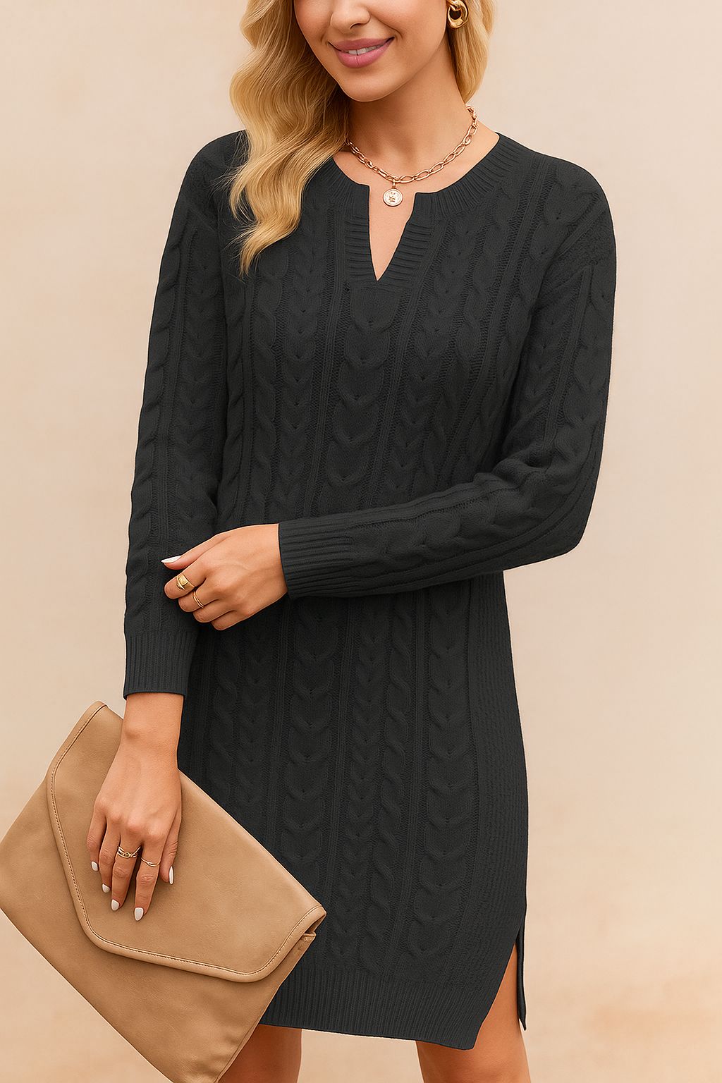 Woman wearing a black cable knit dress holding a beige clutch against a beige background