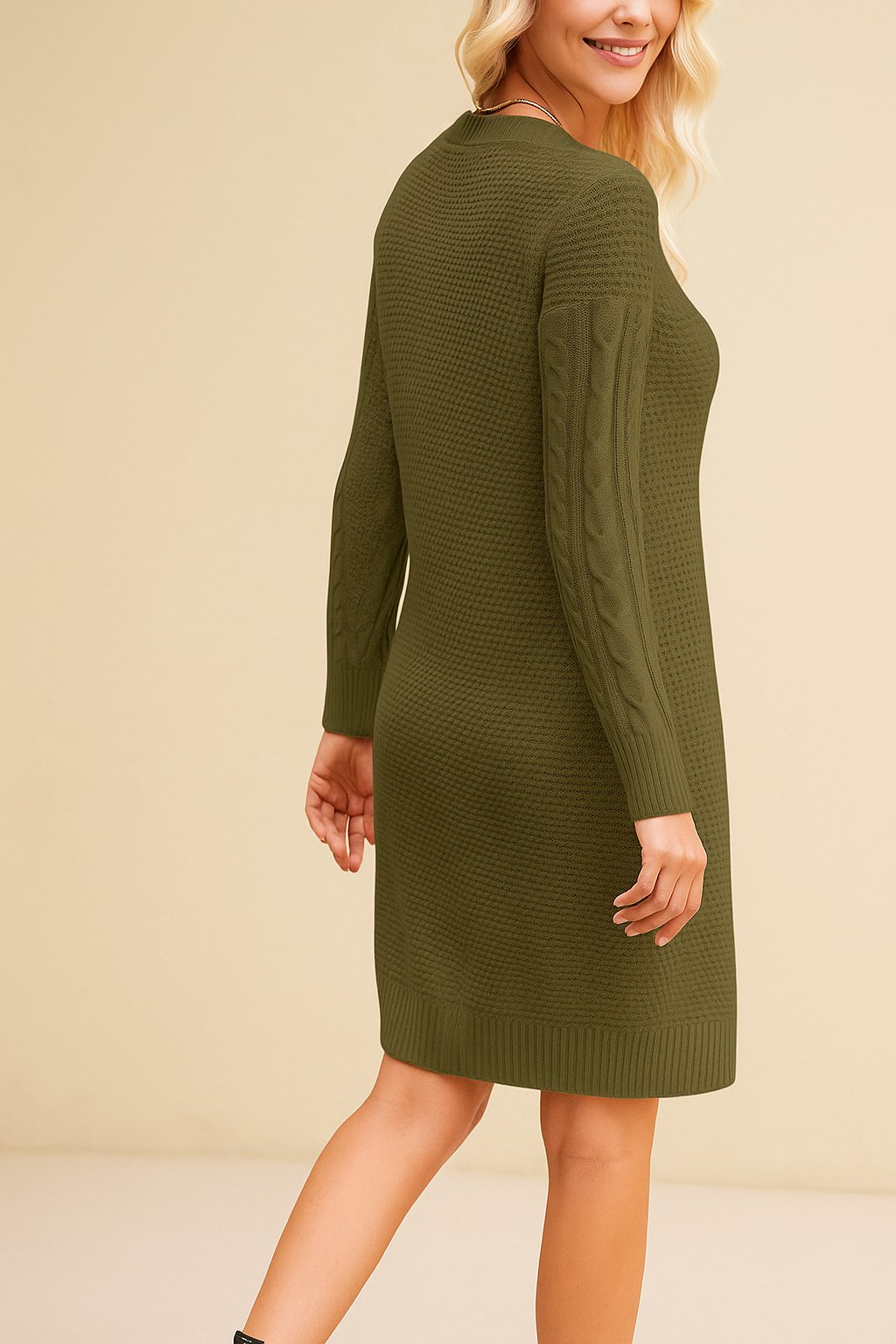 Woman wearing an olive green knitted dress against a beige background