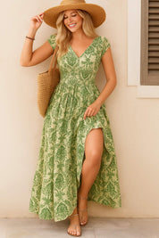 Green boho-print V-neck cap-sleeve maxi dress with smocked waist and side slit — front three-quarter view