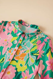 Floral button-down babydoll dress in green multi showing shirt collar and button placket — front detail view