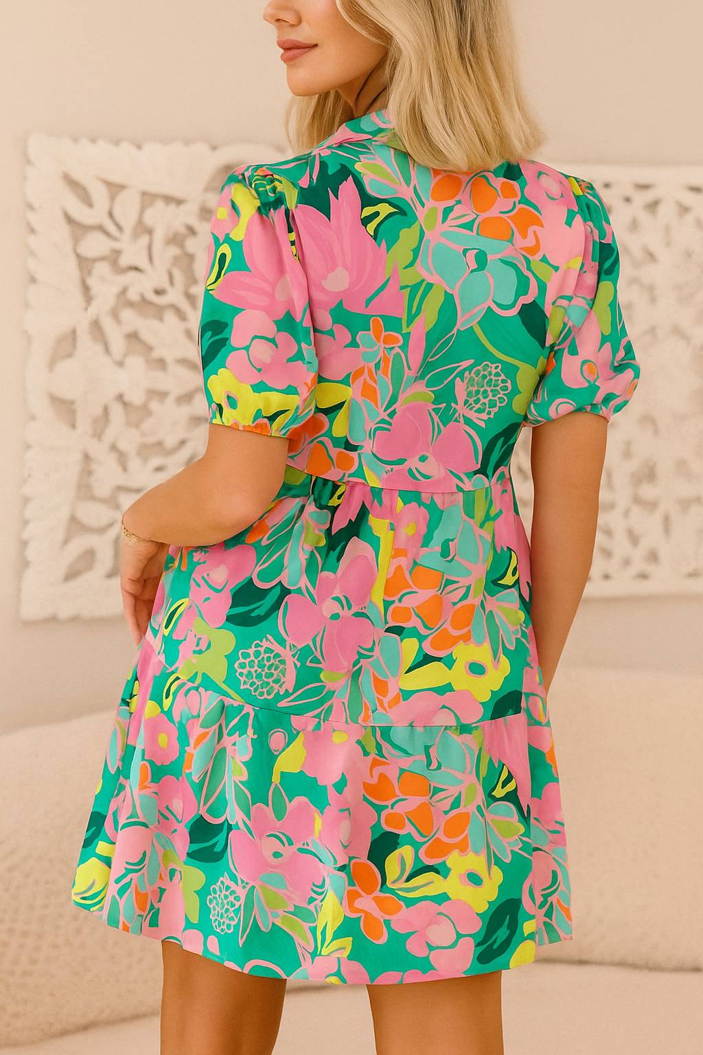Floral button-down babydoll dress in green multi with puff sleeves and tiered mini skirt — back view.