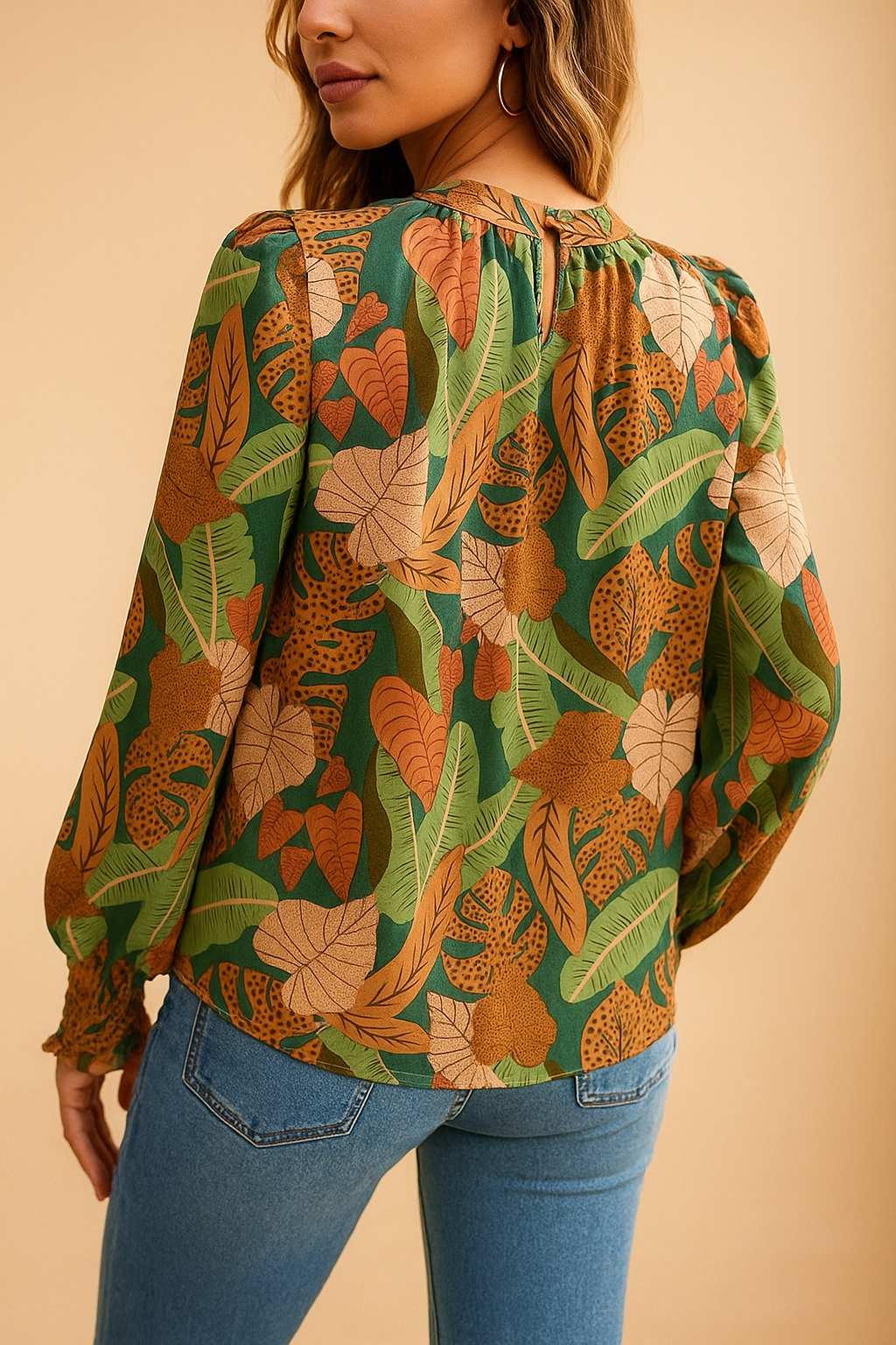 Green tropical leaf-print long-sleeve blouse with clean back panel and straight hem — back view.