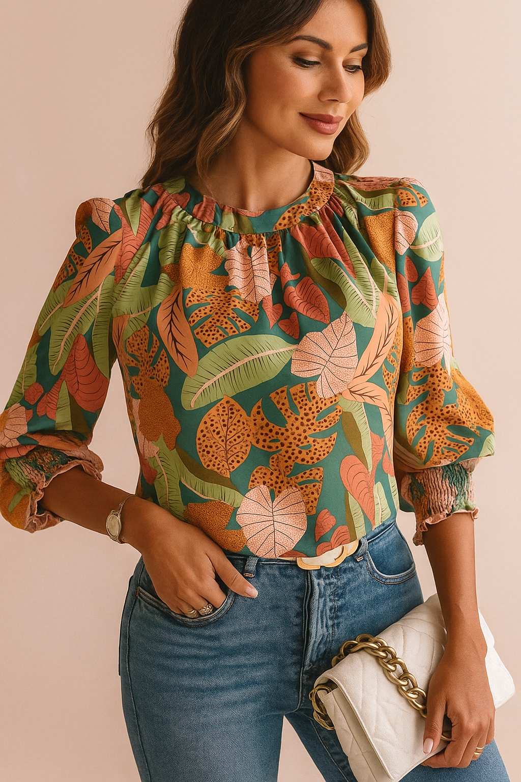 Green tropical leaf-print blouse showing fabric texture, neck gathers and print detail — front detail close-up view.