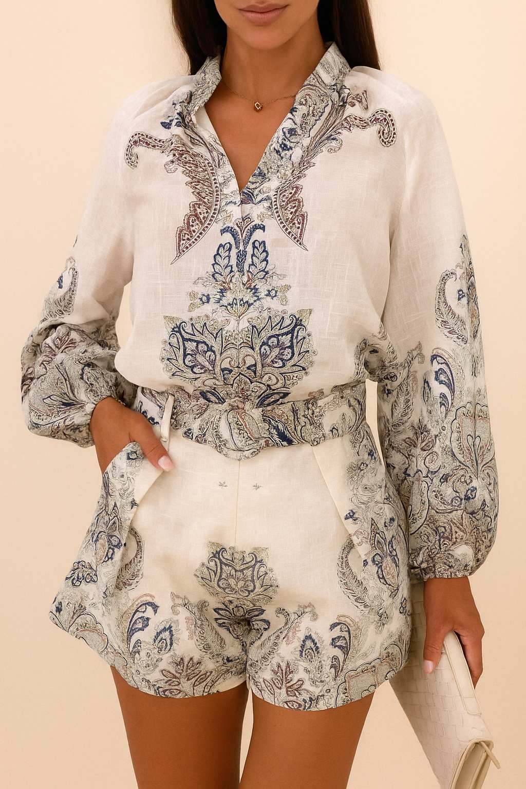 Front detail view of the grey paisley set highlighting the blouse neckline and the shorts’ belt and slant pockets.