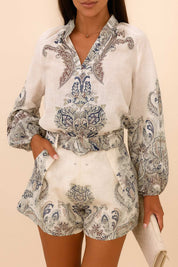 Front detail view of the grey paisley set highlighting the blouse neckline and the shorts’ belt and slant pockets.