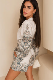 Right three-quarter view of the grey paisley shirt and belted shorts set showing the side profile and pocket line