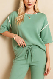Front detail view of the Gum Leaf lounge set highlighting the drawstring waistband and pocket entry.