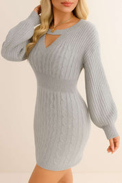 Right three-quarter view of the heather gray cable-knit sweater dress showing the V-neck cutout, ribbed waistband and long balloon sleeves with ribbed cuffs.