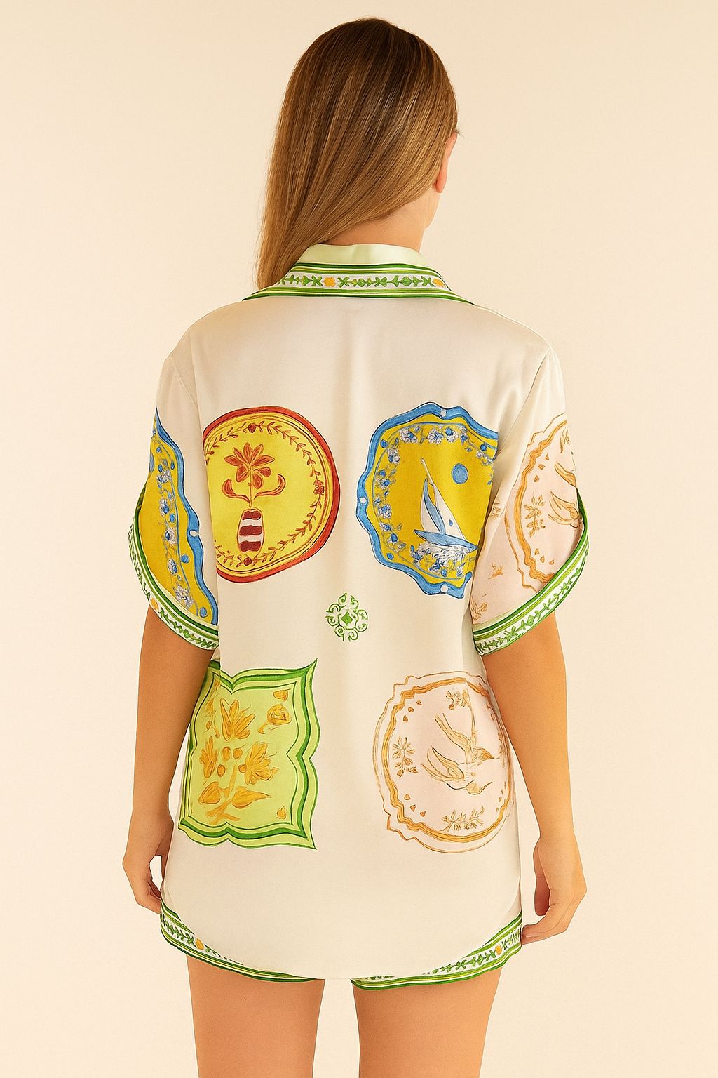 Back view of the ivory-multi printed shirt and shorts set showing the overall artwork, drop-shoulder sleeves and rounded hem.
