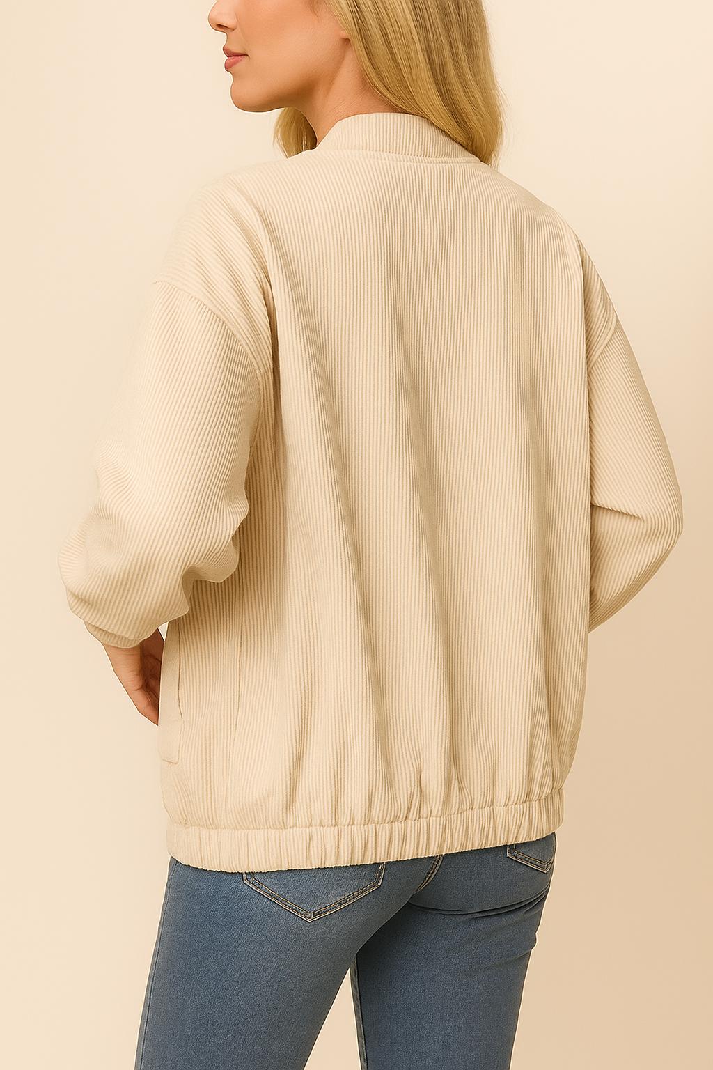 Back three-quarter view of the khaki corduroy snap-button jacket highlighting the ribbed texture, drop-shoulder seam and elastic hem.