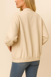 Back three-quarter view of the khaki corduroy snap-button jacket highlighting the ribbed texture, drop-shoulder seam and elastic hem.