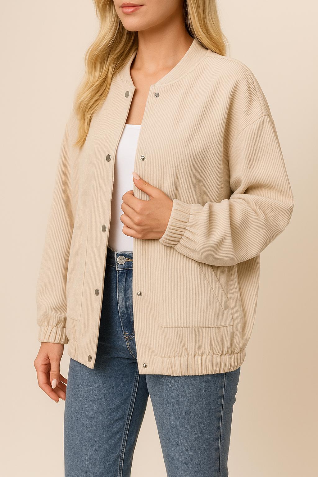 Front three-quarter view of the khaki corduroy snap-button jacket showing the rib-knit collar, button placket and slant welt pockets.