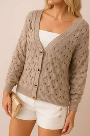 Left three-quarter view of the khaki textured V-neck cardigan with gold-tone buttons and ribbed cuffs and hem