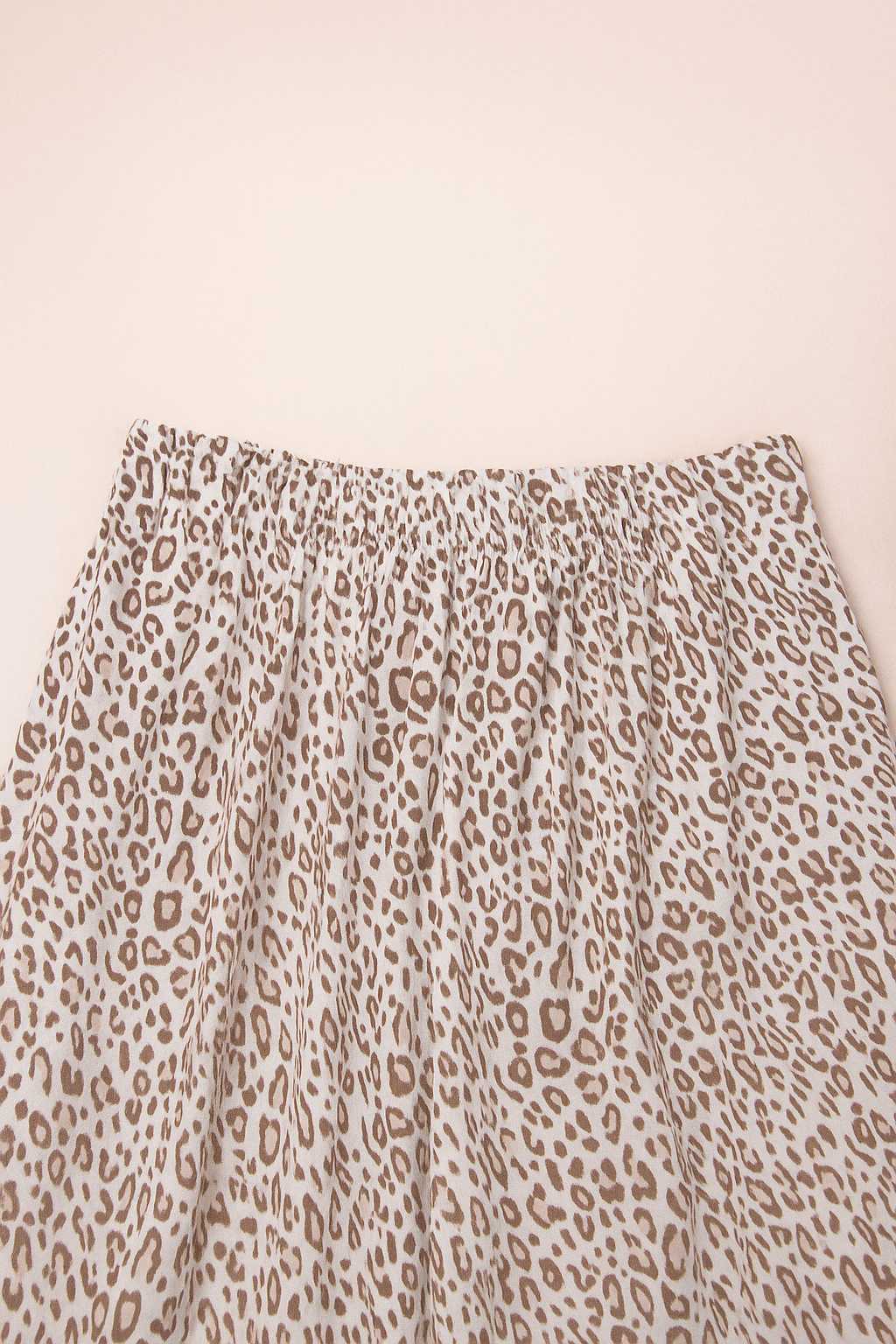 Close-up of leopard print pajama pants with gathered elastic waistband, soft and breathable fabric for women’s loungewear