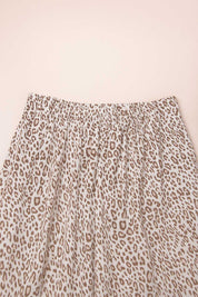 Close-up of leopard print pajama pants with gathered elastic waistband, soft and breathable fabric for women’s loungewear